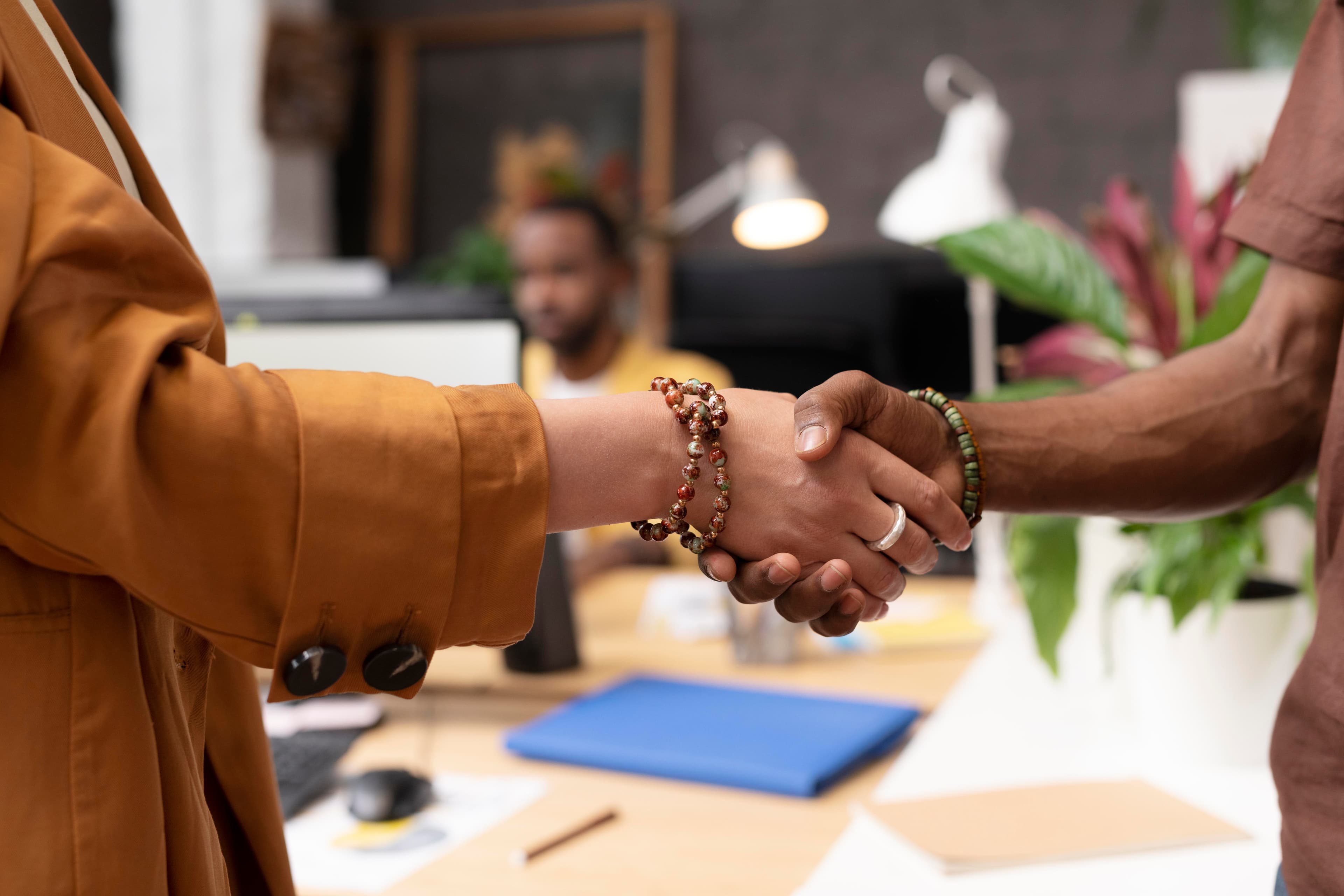 Colleagues shaking hands after a successful meeting
