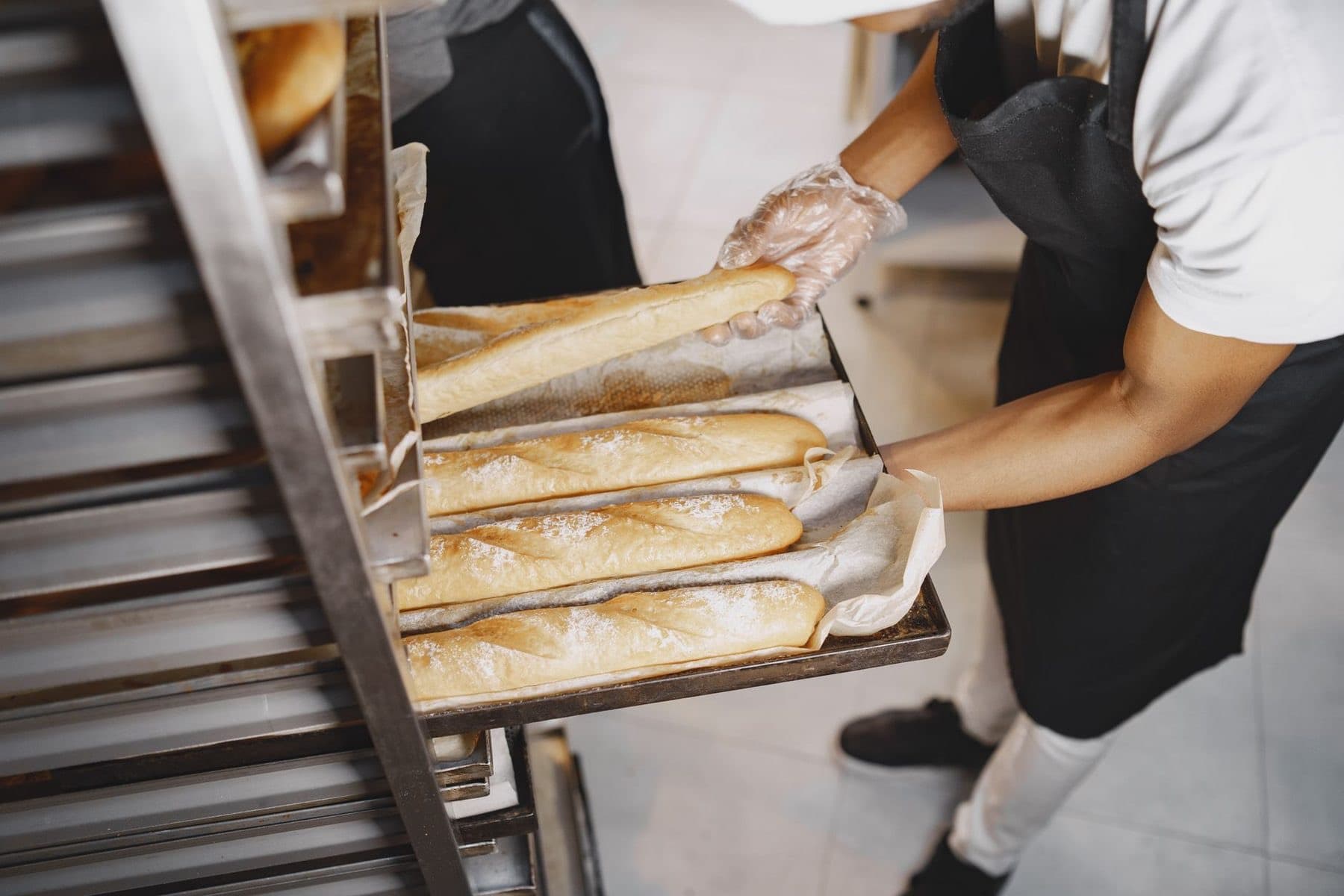 Fresh bread coming off a bakery line