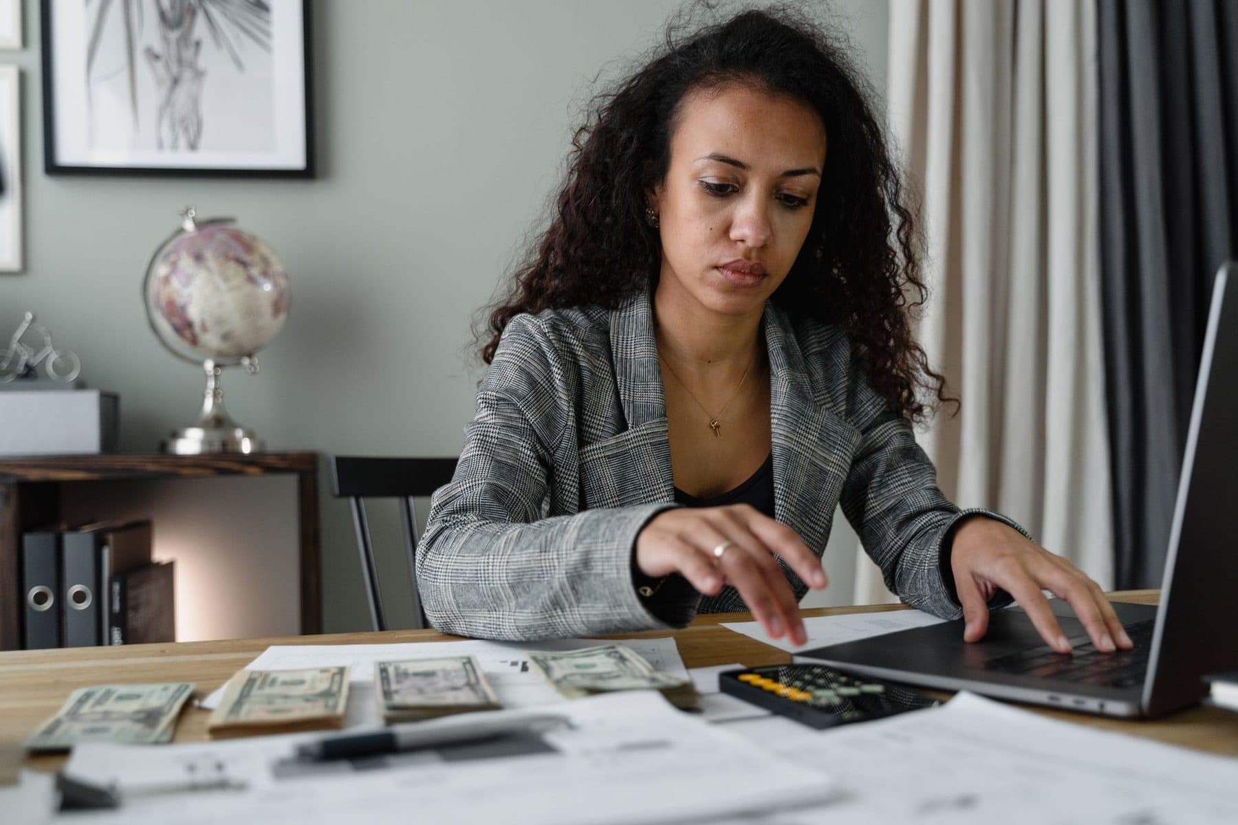 Finance officer working through reports at a desk