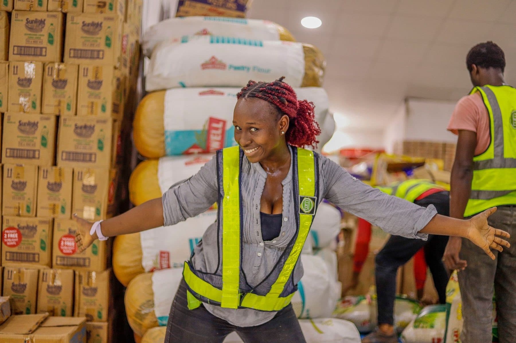 Warehouse worker among stacked goods in Lagos