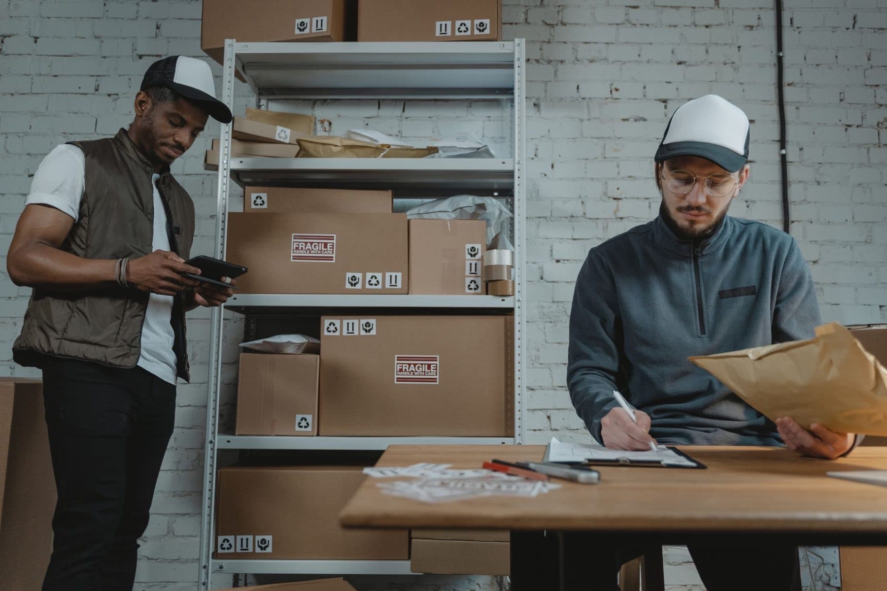 Store room team checking stock against paperwork